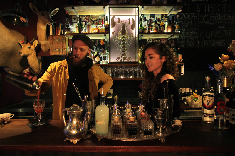 man and a woman tending bar