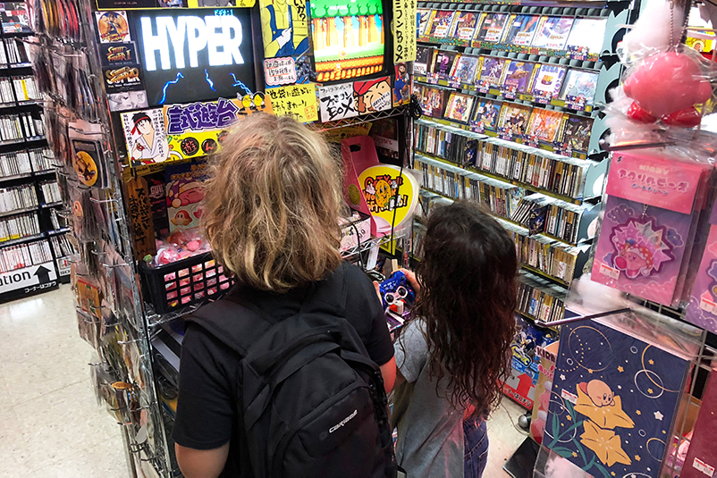 Boy and girl at Super Potato gaming shop in Tokyo