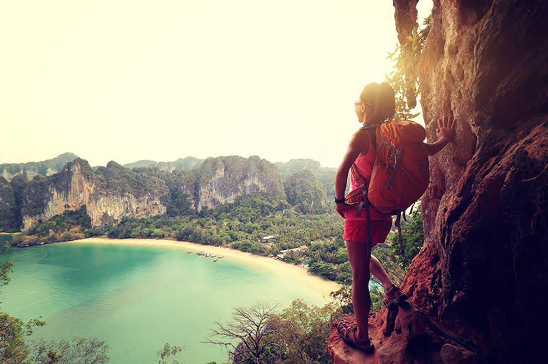 woman hiking railay bay in thailand