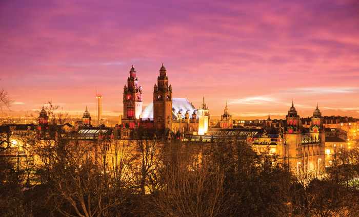 Kelvingrove museums silhouetted against a sunset sky