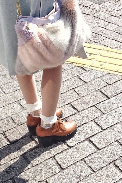 girls shoes and socks standing at crossing