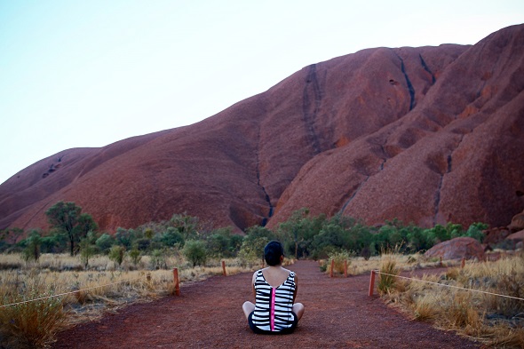 girl in front of uluru