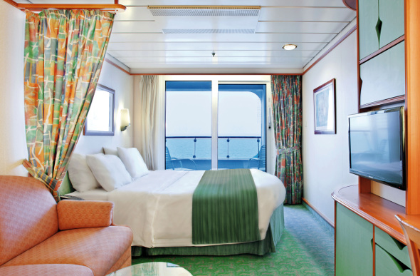 A balcony stateroom on board the Voyager of the Seas cruise ship.