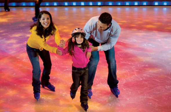 A family ice-skating on board the Voyager of the Seas cruise ship.