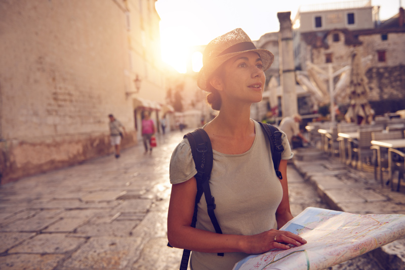 Woman looking at map in Croatia.