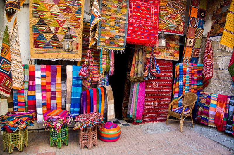 Beautiful textiles draw the eye in a Moroccan market.