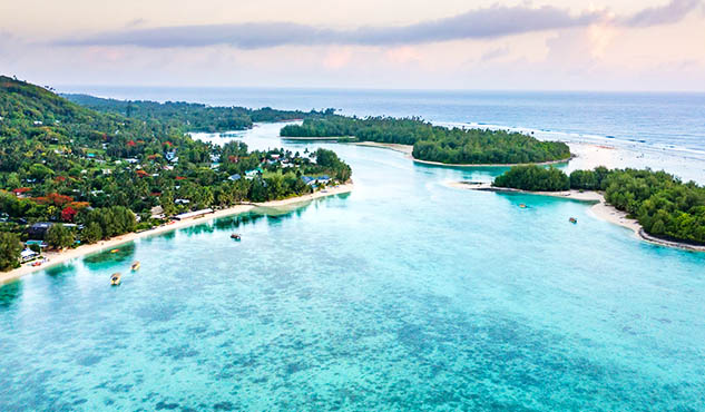 An aerial view of Muri Lagoon at sunrise in Rarotonga in the Cook Islands